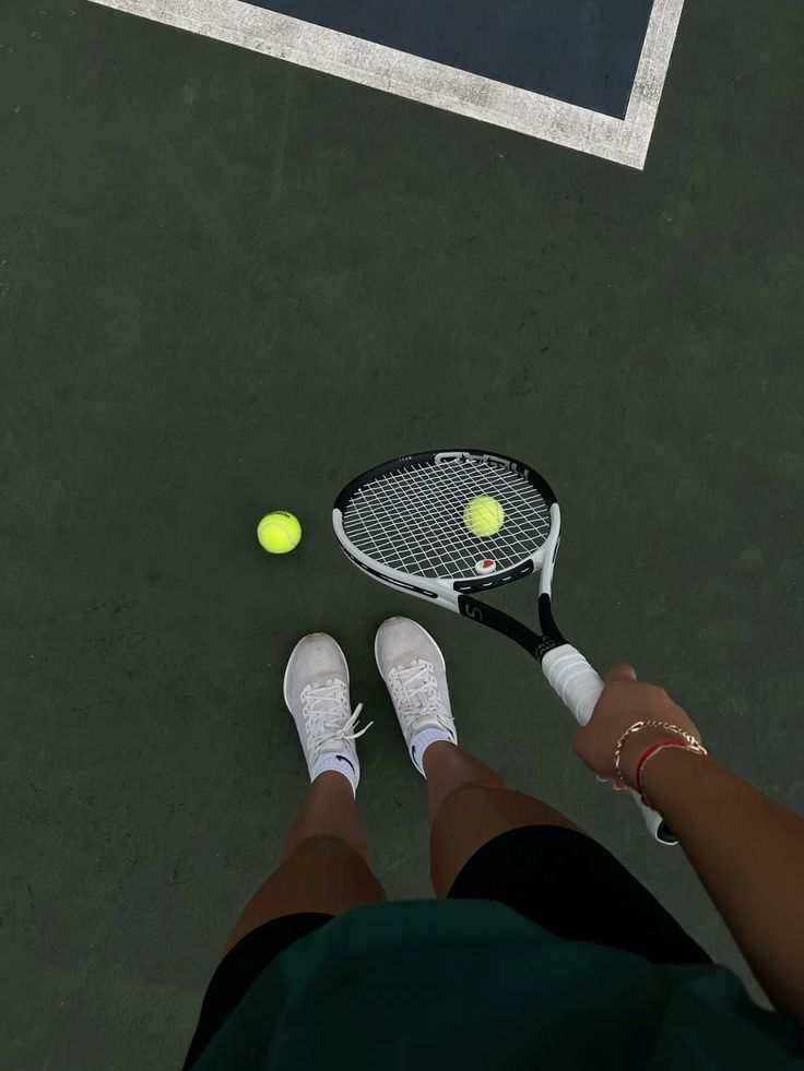 Racket and ball at the baseline